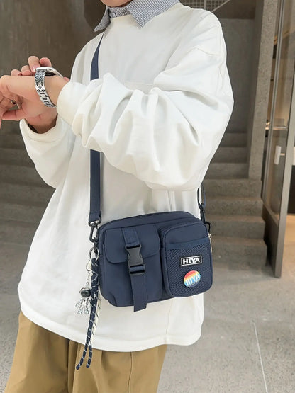 Unisex Casual Plain Color Release Buckle Crossbody Bag with Astronaut Charm, Zipper Crossbody Bag with Random Color Badge, Aesthetic Shoulder Bag, Zippered Sling Bag, Casual Crossbody Bags