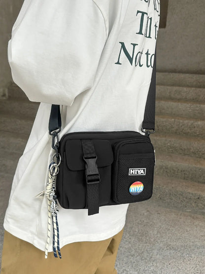 Unisex Casual Plain Color Release Buckle Crossbody Bag with Astronaut Charm, Zipper Crossbody Bag with Random Color Badge, Aesthetic Shoulder Bag, Zippered Sling Bag, Casual Crossbody Bags